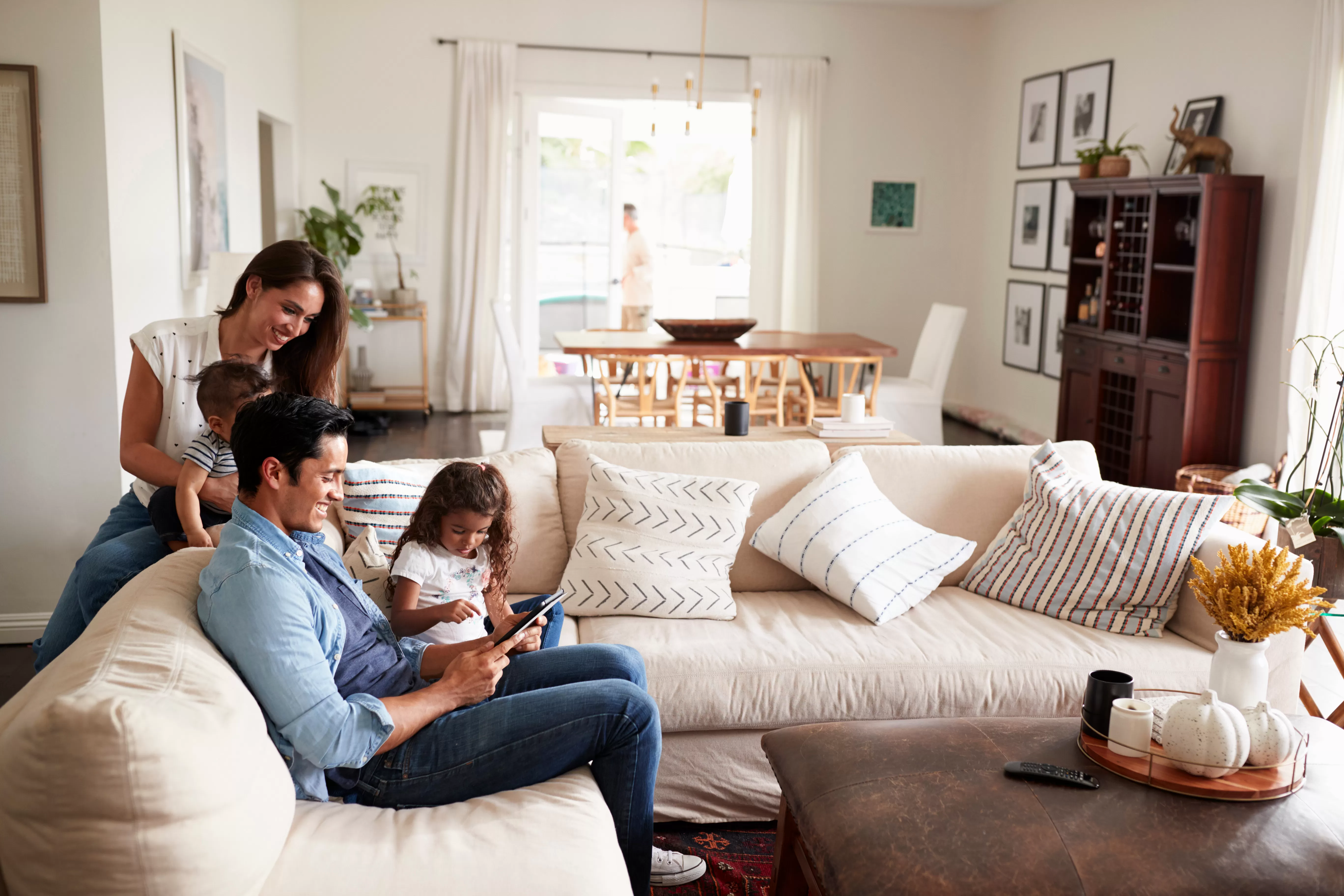 Happy family sitting on the couch in their living room