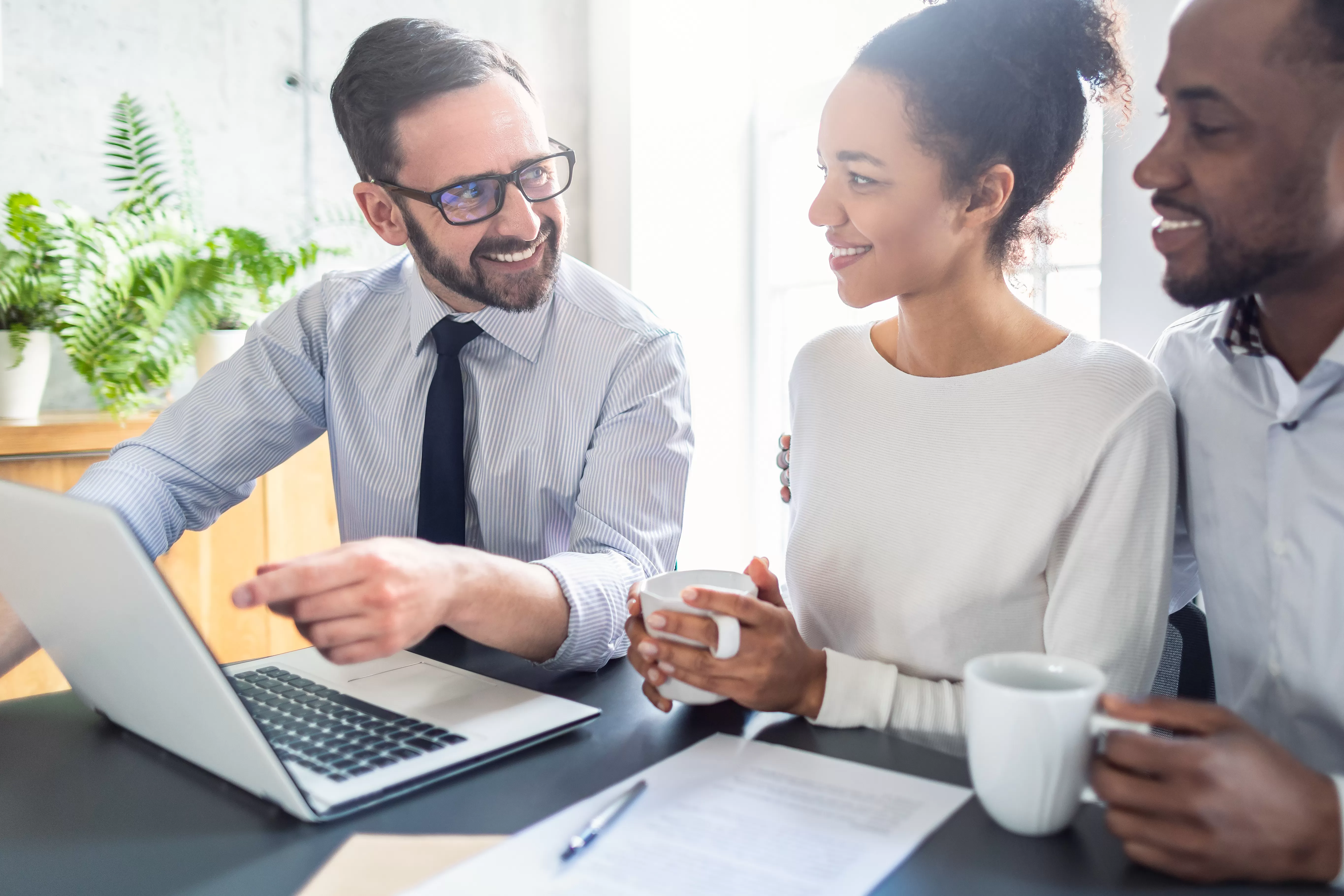 A couple discusses HELOC draw and repayment periods with a credit union representative.