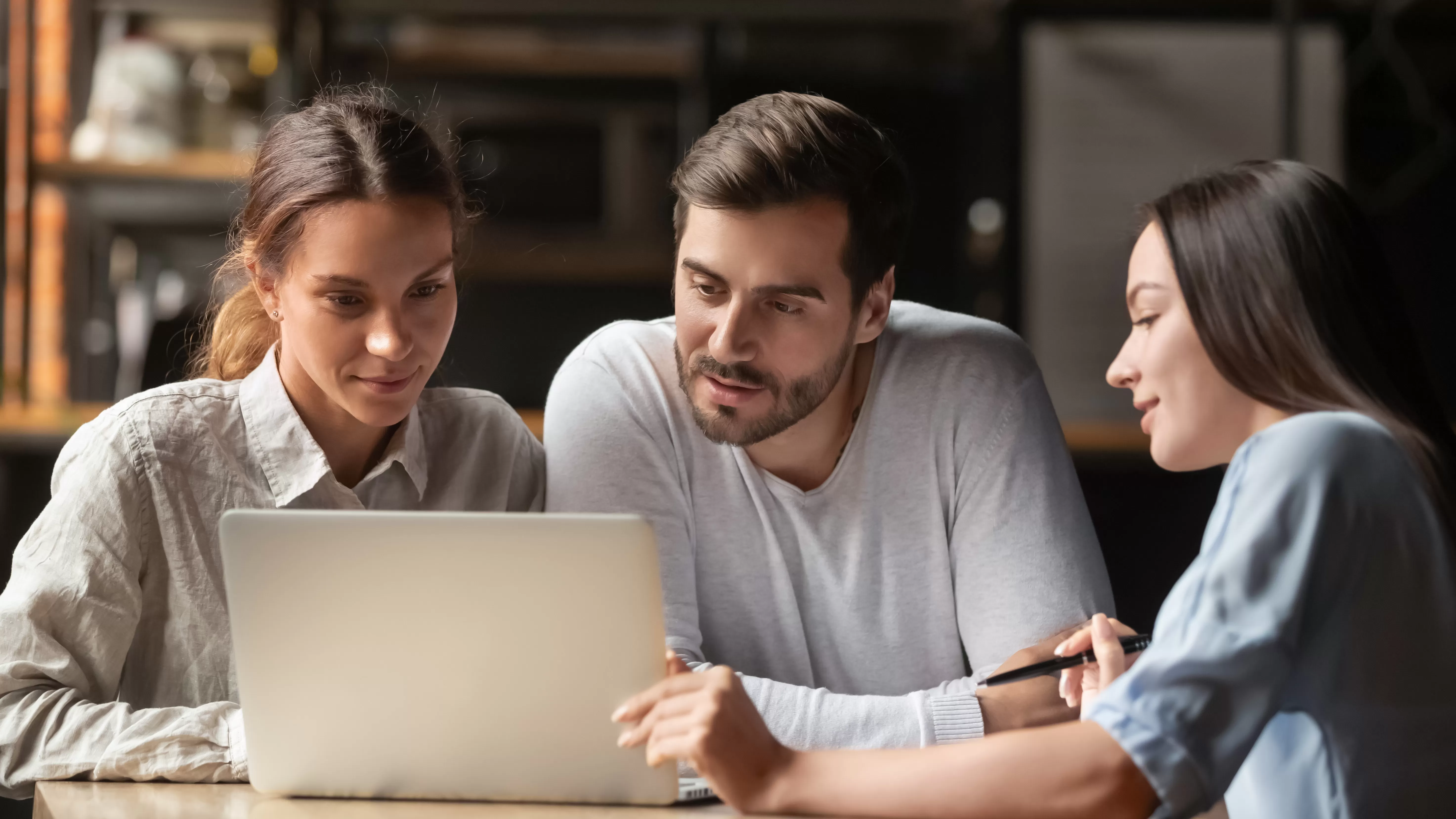 A mortgage lender discussing what are the different types of mortgage loans with a young couple.